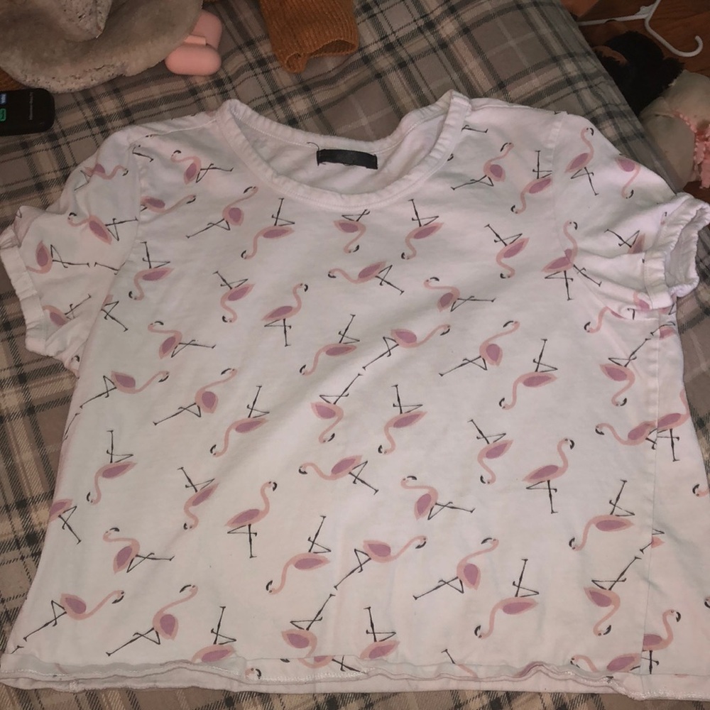 White crop top with flamingoes on it